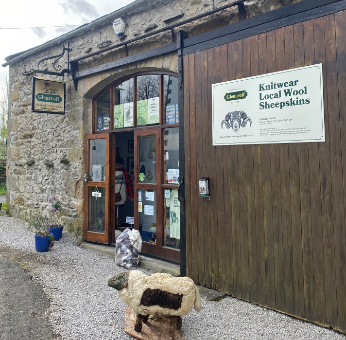 Front of Glencroft shop showing large wooden barn door and glass entrance